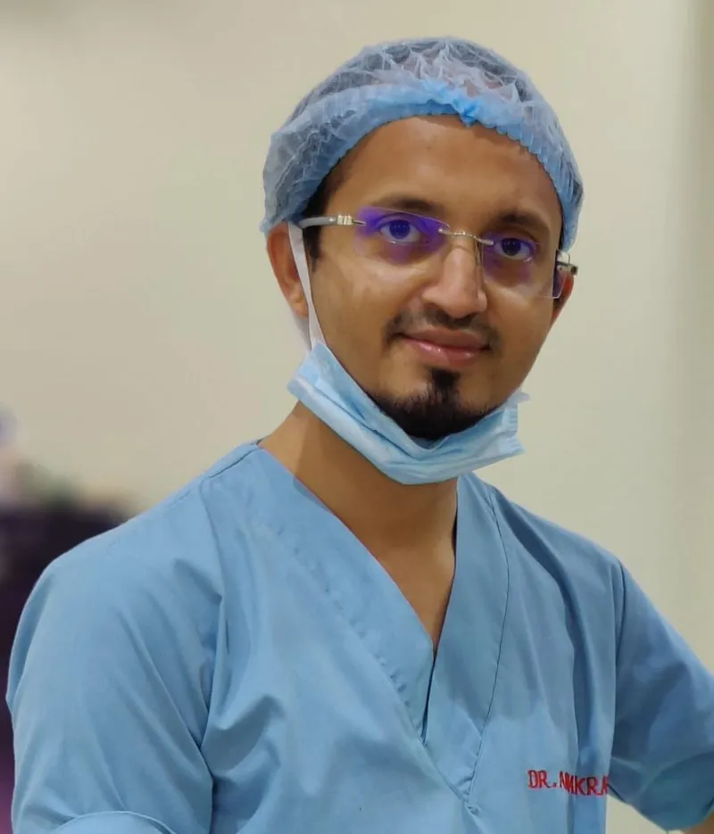 Dr. Abu Akrama in surgical scrubs